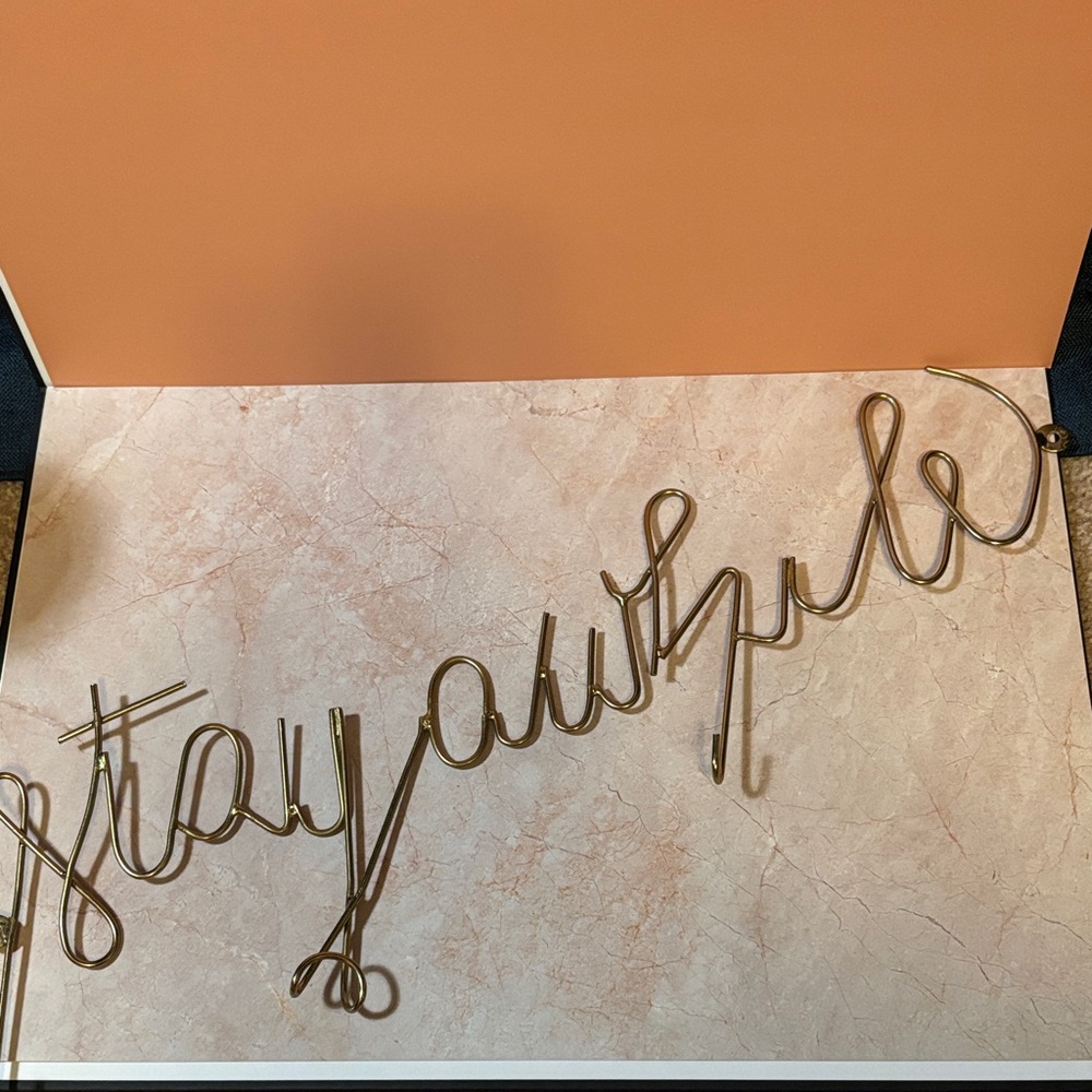 Gold 'Stay Awhile' Wall Decor and key hook